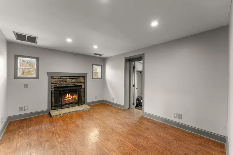 Living room with stone fireplace